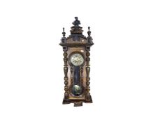 A 19th century mahogany cased Vienna wall clock with pendulum and key (af)
