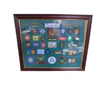 A scouting badge montage framed