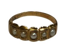 A 15ct yellow gold ring set with five seed pearls, size N, 2g.