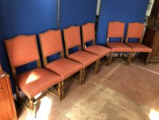 A set of six continental oak dining chairs in pink fabric