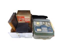 A cased Grundig reel to reel player together with a box of reels, case of cassettes,