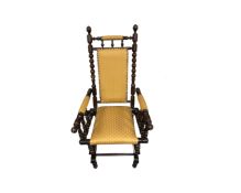 A 20th century beech framed rocking chair