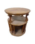 An early 20th century continental oak circular book table,