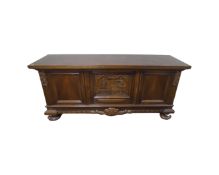 A 20th century Scandinavian three door sideboard with carved panel door on bun feet,