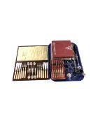 A tray containing boxed and unboxed cutlery including Viners cake forks, tea spoons, dessert spoons,