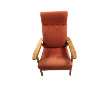 A mid 20th century teak relaxer armchair