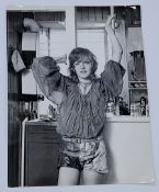 After Photographer Tony Rios a photo of American actress Patti D'arbanville (Known for her