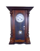 A continental 8-day wall clock with pendulum