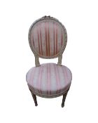 A French style salon bedroom chair in striped fabric