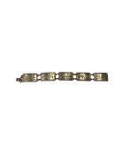 A silver floral panel bracelet, London 1945, Lonwick Industries ltd, 33.7g, length 19.5 cm.