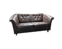 A Danish brown buttoned leather two seater settee