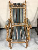 A 20th century blond oak rocking chair