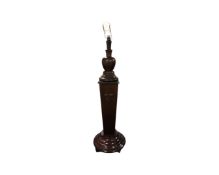 An early 20th century heavy mahogany and beech pedestal standard lamp,