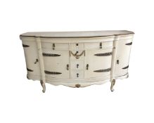 A continental white and gilt four door six drawer shaped fronted buffet sideboard