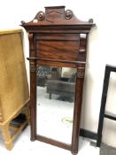 A 19th century mahogany hall mirror with pillar supports,
