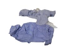 A vintage luggage case containing gent's shirts