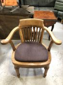 An Edwardian oak smoker's armchair