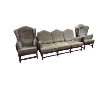 An Ercol elm and beech framed three piece lounge suite comprising of three seater and two wing