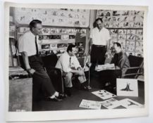 Vintage Walt Disney photo of Walt and animators designing scenes for the 1959 classic 'Sleeping