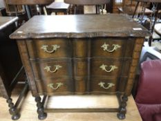 A continental oak and beech three drawer chest on raised legs, height 64 cm width 65 cm.