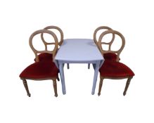 A painted pine flap sided kitchen table together with a set of four Victorian style chairs