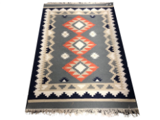 A John Lewis kilim fringed rug