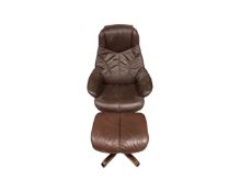 A brown leather swivel relaxer armchair with footstool