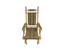 A 20th century blond oak rocking chair