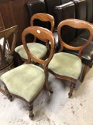 Three Victorian mahogany balloon backed chairs