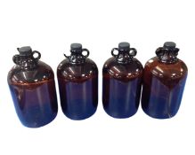 Four glass storage bottles.
