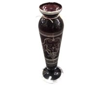 A Twentieth Century ruby glass tapered vase, with decorative silvered overlay, on circular base,