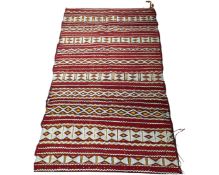 An eastern fringed kilim, 92cm by 160cm.