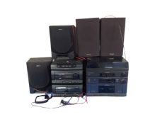A Sony music centre with speakers together with a Toshiba music system with speakers.