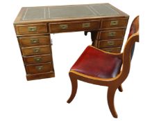 A reproduction yew wood military style pedestal desk together with Burgundy leather covered chair.