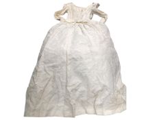 A vintage wedding dress together with a vintage fur coat and a fur lined bag.