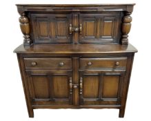 An Ercol oak buffet sideboard