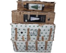 Four artificial Christmas trees in boxes CONDITION REPORT: Contents not checked.