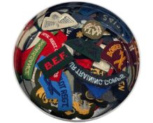 A large quantity of cloth badges, military insignias, HM Coastguard, Warden etc.