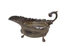 A silver sauce boat.