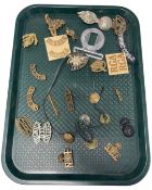 A collection of military badges, Cumberland, Yorkshire, St. Edward's school etc.