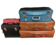 Three vintage luggage cases and two boxes of vinyl records.