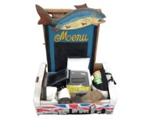 A box containing golf shoes, portable colour LCD TV, TomTom satnav in box, a menu board etc.