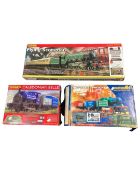 Three Hornby OO gauge train sets including Caledonian Belle, Industrial Freight and Flying Scotsman.
