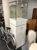 A jeweller's upright shop display case with keys.