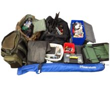 A large quantity of fishing equipment including rods, reels, a bait box,