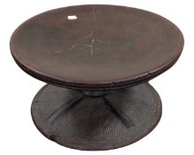 An African hardwood pedestal stand, diameter 42 cm, height 23 cm.