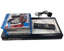 An LG Blu-Ray disc player with remote control and six Blu-Ray discs.