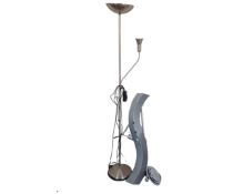 An adjustable metal uplighter together with a further adjustable lamp.