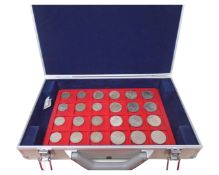 A case containing a large quantity of trays of coins, 20th century sixpence pieces,