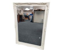An antique style cream bevelled mirror